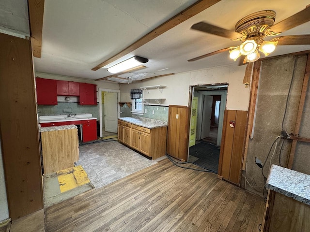 8444 Fish Hatchery Rd, Burlington, WI 53105 - kitchen featuring light wood-style flooring, a wainscoted wall, a ceiling fan, and light countertops