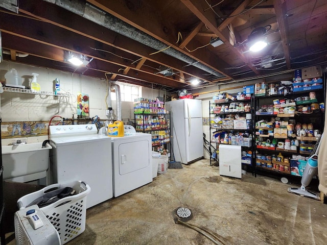 1130 10th St S, Wisconsin Rapids, WI 54494 - basement with freestanding refrigerator, washing machine and dryer, and a sink