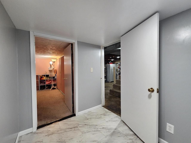 1130 10th St S, Wisconsin Rapids, WI 54494 - hallway with light marble finish floors, stairway, and baseboards