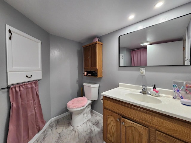 1130 10th St S, Wisconsin Rapids, WI 54494 - full bath with marble finish floors, vanity, toilet, baseboards, and recessed lighting