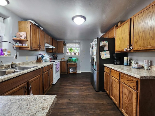 1130 10th St S, Wisconsin Rapids, WI 54494 - kitchen with white electric stove, open shelves, a sink, freestanding refrigerator, and under cabinet range hood