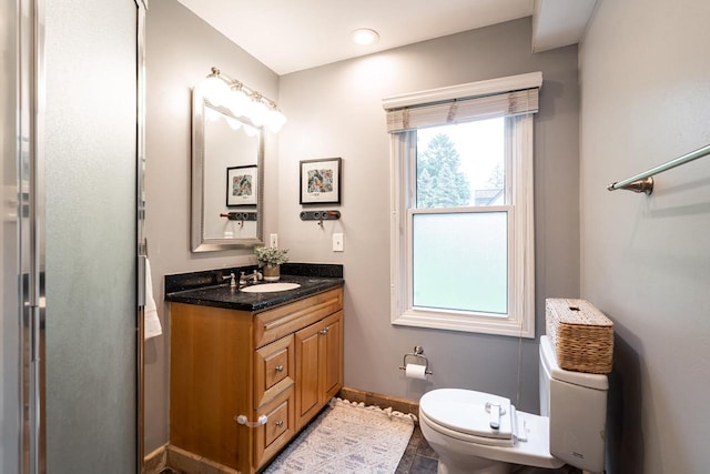 640 Crystal Ln, Elm Grove, WI 53122 - bathroom featuring vanity, toilet, and baseboards