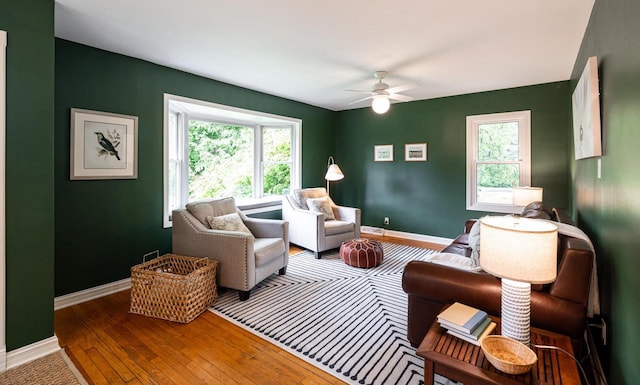 640 Crystal Ln, Elm Grove, WI 53122 - living area with plenty of natural light, hardwood / wood-style flooring, a ceiling fan, and baseboards