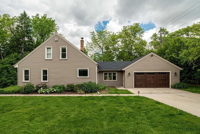640 Crystal Ln, Elm Grove, WI 53122 - view of front of property featuring a chimney, an attached garage, concrete driveway, and a front yard