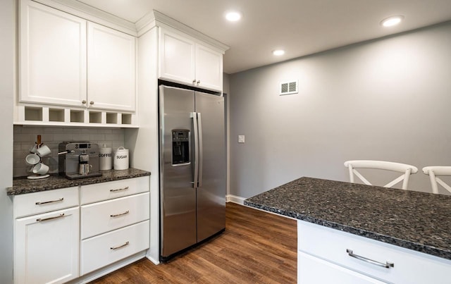 640 Crystal Ln, Elm Grove, WI 53122 - kitchen with stainless steel fridge with ice dispenser, tasteful backsplash, white cabinetry, dark wood-style flooring, and dark stone countertops