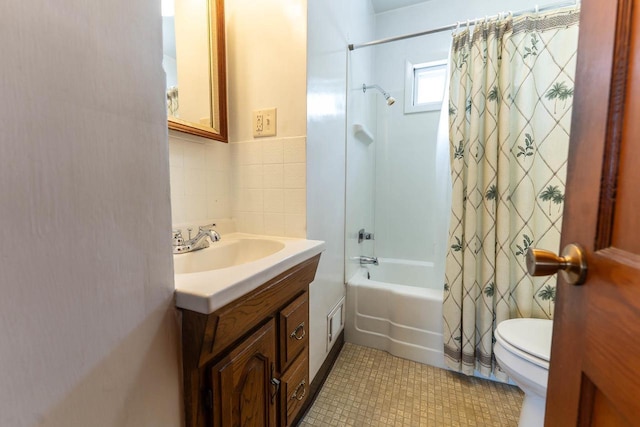 1816 Goodland Ave, Tomah, WI 54660 - bathroom with toilet, shower / tub combo, vanity, tile patterned flooring, and tile walls