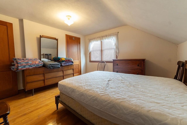 1816 Goodland Ave, Tomah, WI 54660 - bedroom featuring light wood finished floors and lofted ceiling
