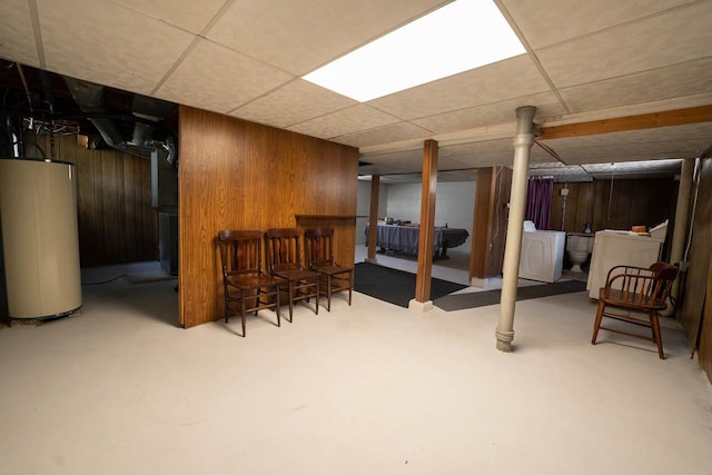 1816 Goodland Ave, Tomah, WI 54660 - finished basement with washer / clothes dryer, gas water heater, a bar, and wood walls