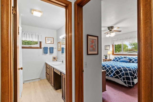 404 W Albert St, Portage, WI 53901 - hallway with a sink and light wood-type flooring