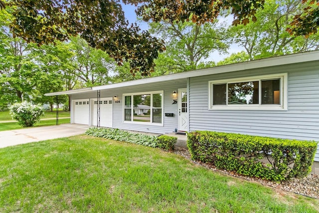 404 W Albert St, Portage, WI 53901 - single story home featuring a front yard, a garage, and concrete driveway