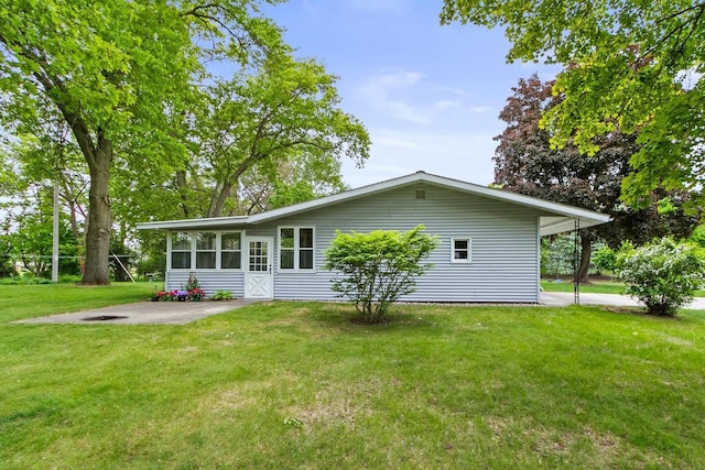 404 W Albert St, Portage, WI 53901 - back of property featuring a yard and a sunroom