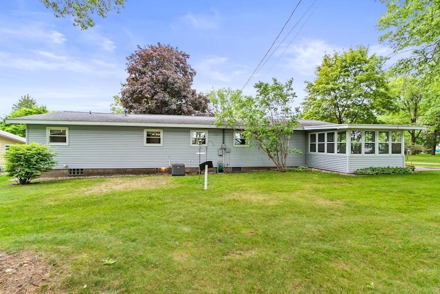 404 W Albert St, Portage, WI 53901 - rear view of property with cooling unit, a lawn, and a sunroom