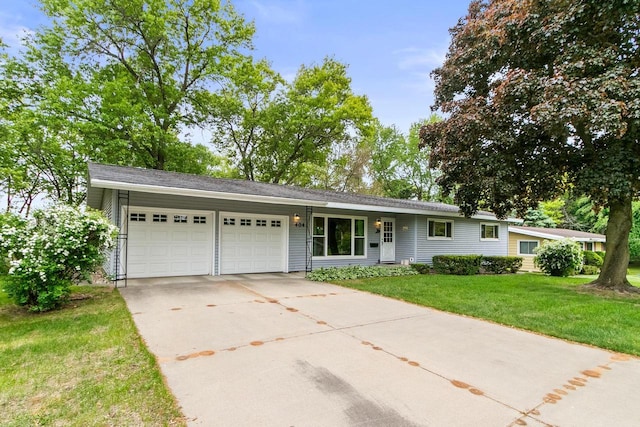 404 W Albert St, Portage, WI 53901 - ranch-style house with an attached garage, driveway, and a front yard