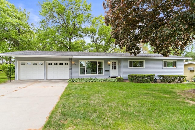 404 W Albert St, Portage, WI 53901 - single story home with a garage, concrete driveway, and a front lawn