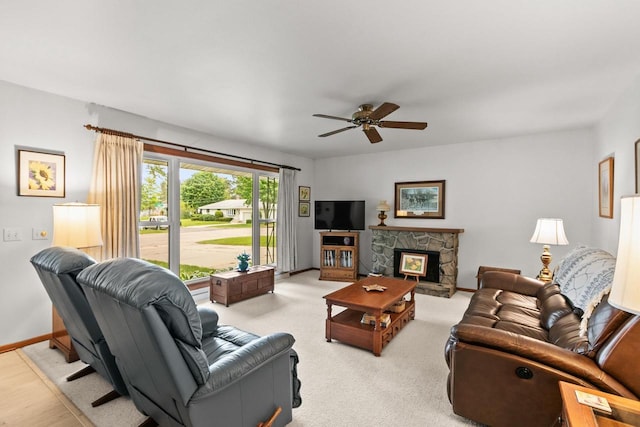 404 W Albert St, Portage, WI 53901 - living room featuring a ceiling fan, baseboards, and a fireplace
