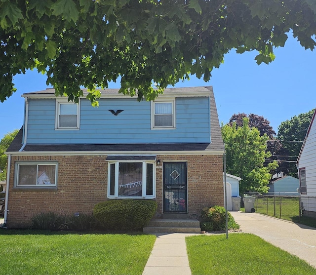 5320 N 60th St, Milwaukee, WI 53218 - traditional-style home with brick siding and a shingled roof