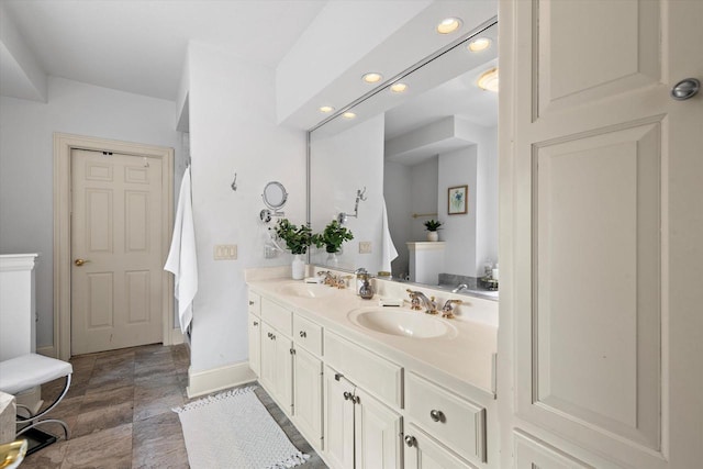 N26W30255 Maple Ave, Pewaukee, WI 53072 - full bathroom featuring double vanity, recessed lighting, and baseboards