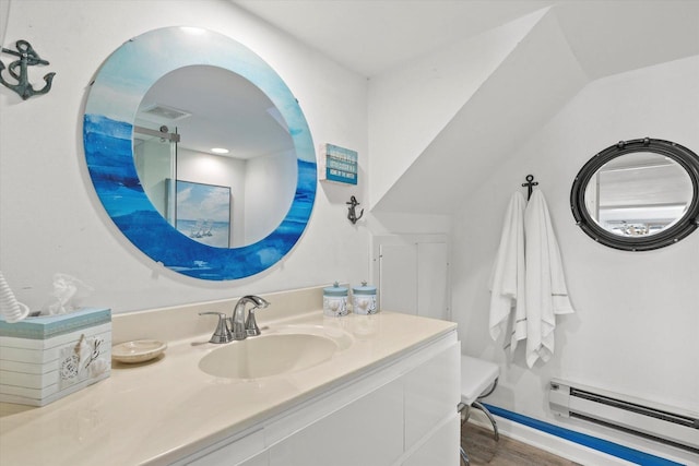N26W30255 Maple Ave, Pewaukee, WI 53072 - bathroom featuring baseboard heating, vanity, and wood finished floors
