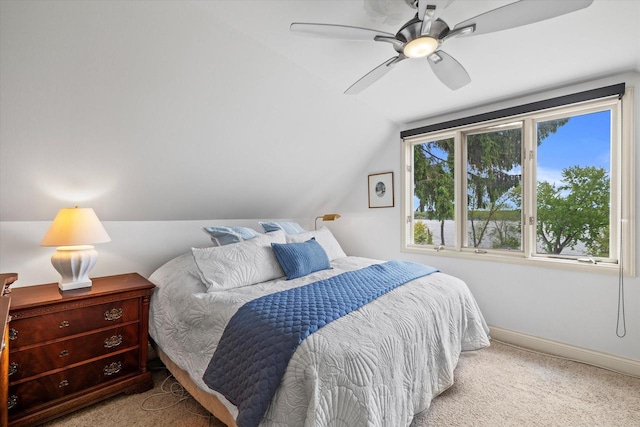 N26W30255 Maple Ave, Pewaukee, WI 53072 - carpeted bedroom with lofted ceiling, baseboards, and a ceiling fan