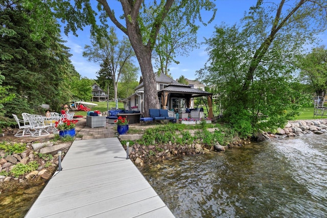 N26W30255 Maple Ave, Pewaukee, WI 53072 - dock area featuring a gazebo, an outdoor hangout area, a water view, and a patio area