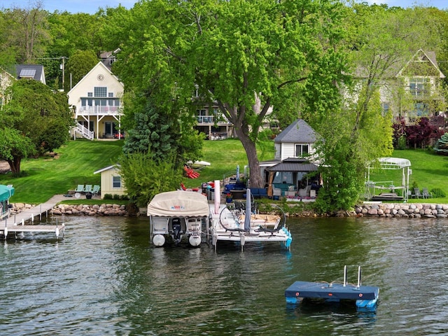N26W30255 Maple Ave, Pewaukee, WI 53072 - dock featuring boat lift, a gazebo, a water view, and a lawn