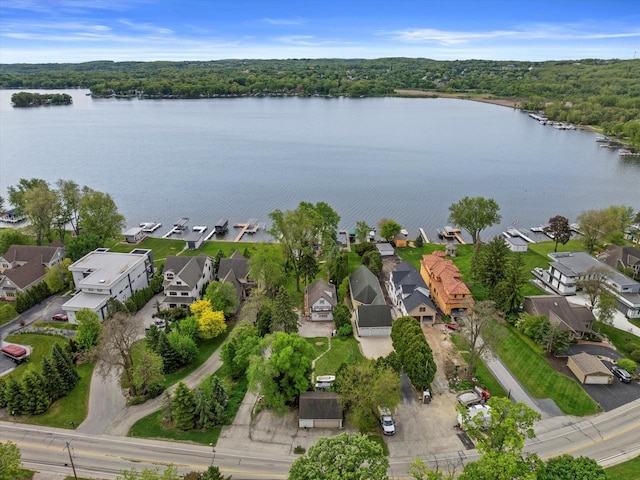 N26W30255 Maple Ave, Pewaukee, WI 53072 - aerial perspective of suburban area with a heavily wooded area and a large body of water