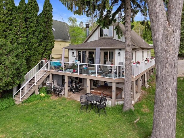 N26W30255 Maple Ave, Pewaukee, WI 53072 - rear view of house featuring stairs, a wooden deck, a lawn, a patio, and a shingled roof