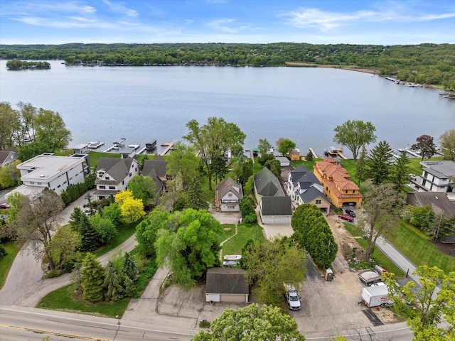 N26W30255 Maple Ave, Pewaukee, WI 53072 - aerial perspective of suburban area with a large body of water and a forest
