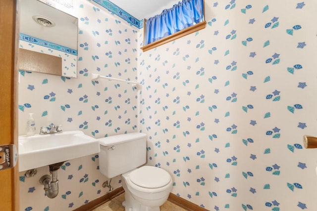 4998 Sterling Dr, Greendale, WI 53129 - bathroom with toilet, wallpapered walls, and baseboards