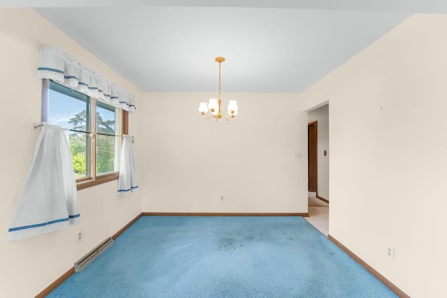 4998 Sterling Dr, Greendale, WI 53129 - carpeted spare room with a chandelier and baseboards