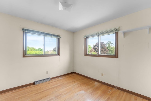 4998 Sterling Dr, Greendale, WI 53129 - spare room with baseboards and light wood-type flooring
