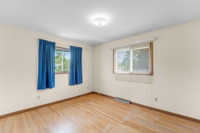 4998 Sterling Dr, Greendale, WI 53129 - unfurnished room with light wood-style flooring and baseboards