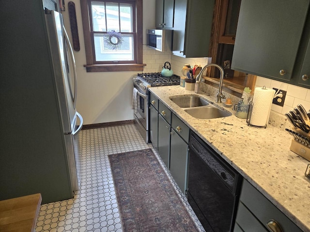 3609 Gregory St, Madison, WI 53711 - kitchen with stainless steel appliances, a sink, decorative backsplash, and baseboards