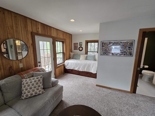 3609 Gregory St, Madison, WI 53711 - carpeted bedroom featuring wooden walls, access to outside, baseboards, recessed lighting, and ensuite bathroom