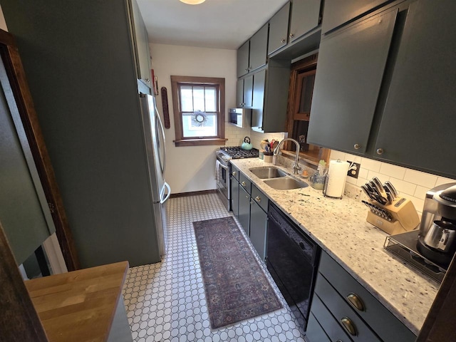 3609 Gregory St, Madison, WI 53711 - kitchen featuring gas range, dishwasher, a sink, backsplash, and baseboards