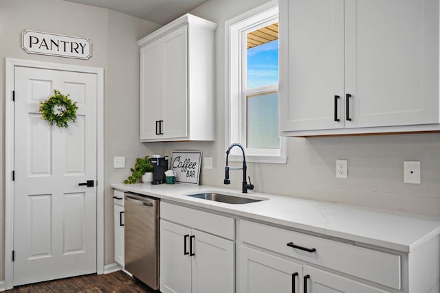 972 Margarets Way, Belleville, WI 53508 - kitchen featuring a sink, stainless steel dishwasher, white cabinetry, dark wood-style floors, and light stone counters