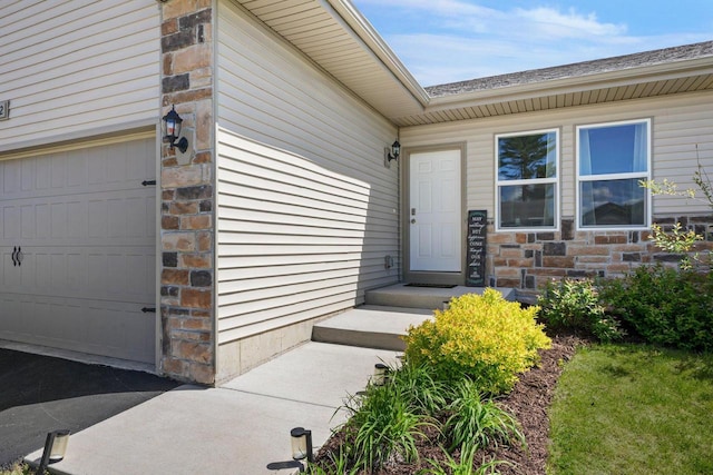 972 Margarets Way, Belleville, WI 53508 - property entrance featuring a garage and stone siding