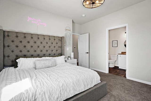972 Margarets Way, Belleville, WI 53508 - bedroom with dark colored carpet, baseboards, and connected bathroom