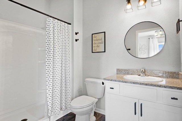 972 Margarets Way, Belleville, WI 53508 - bathroom with vanity, a shower with curtain, toilet, and wood finished floors