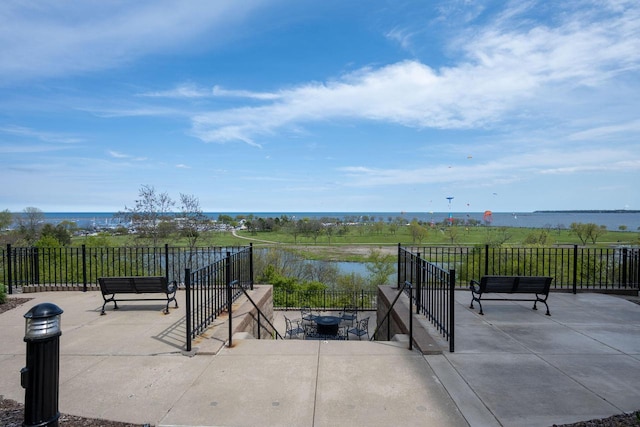 1300 N Prospect Ave Unit 205, Milwaukee, WI 53202 - view of patio / terrace featuring a water view and an outdoor fire pit