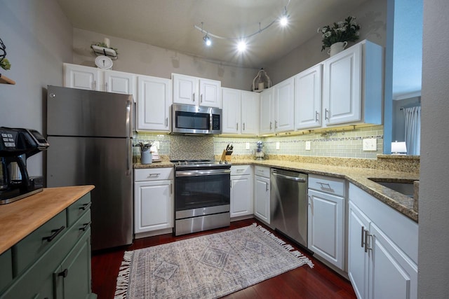 1300 N Prospect Ave Unit 205, Milwaukee, WI 53202 - kitchen with appliances with stainless steel finishes, tasteful backsplash, and white cabinets