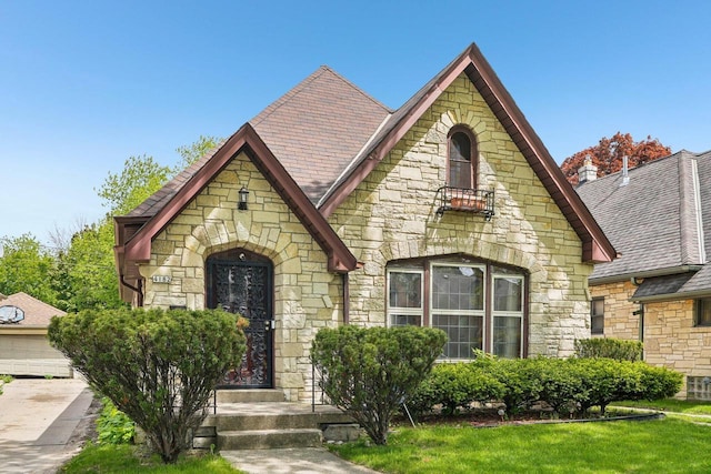4182 N 13th St, Milwaukee, WI 53209 - view of front of home with stone siding and a front lawn