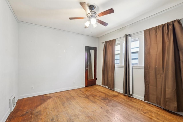 4182 N 13th St, Milwaukee, WI 53209 - spare room featuring wood-type flooring, ceiling fan, and baseboards