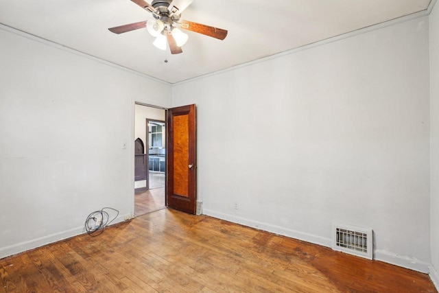 4182 N 13th St, Milwaukee, WI 53209 - empty room with a ceiling fan, light wood finished floors, baseboards, and crown molding