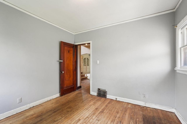 4182 N 13th St, Milwaukee, WI 53209 - empty room with crown molding, hardwood / wood-style floors, and baseboards