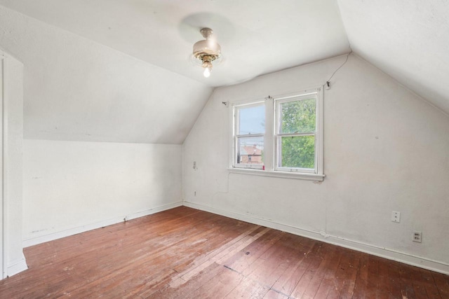 4182 N 13th St, Milwaukee, WI 53209 - bonus room featuring hardwood / wood-style floors, lofted ceiling, and baseboards