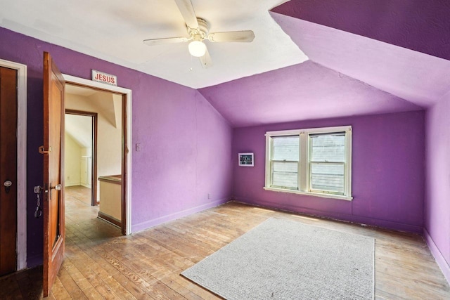 4182 N 13th St, Milwaukee, WI 53209 - unfurnished room with a ceiling fan, vaulted ceiling, wood finished floors, and baseboards