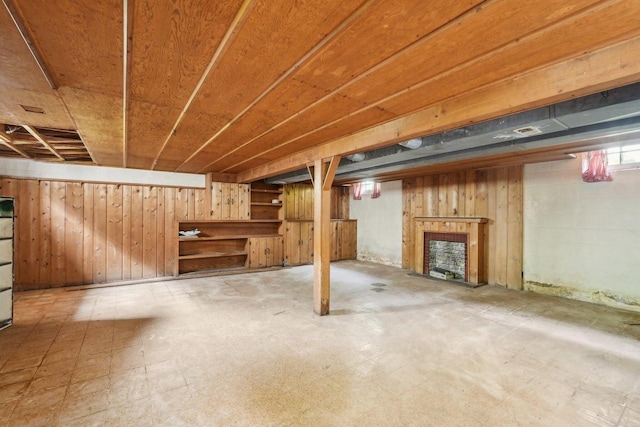 4182 N 13th St, Milwaukee, WI 53209 - basement with tile patterned floors, wooden walls, and a fireplace