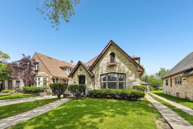 4182 N 13th St, Milwaukee, WI 53209 - tudor home with stone siding and a front yard
