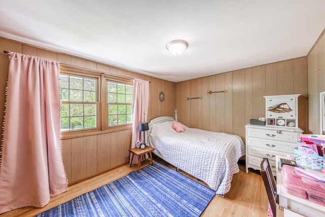 12105 W Shawnee Pass, Mequon, WI 53097 - bedroom featuring wood finished floors and wood walls